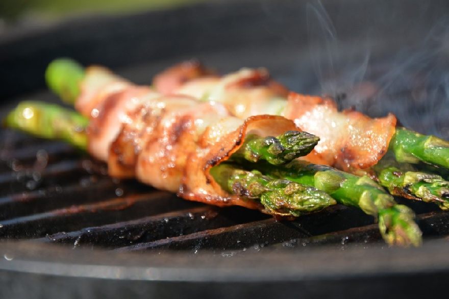 Asparagus wrapped in bacon grilled on the grill