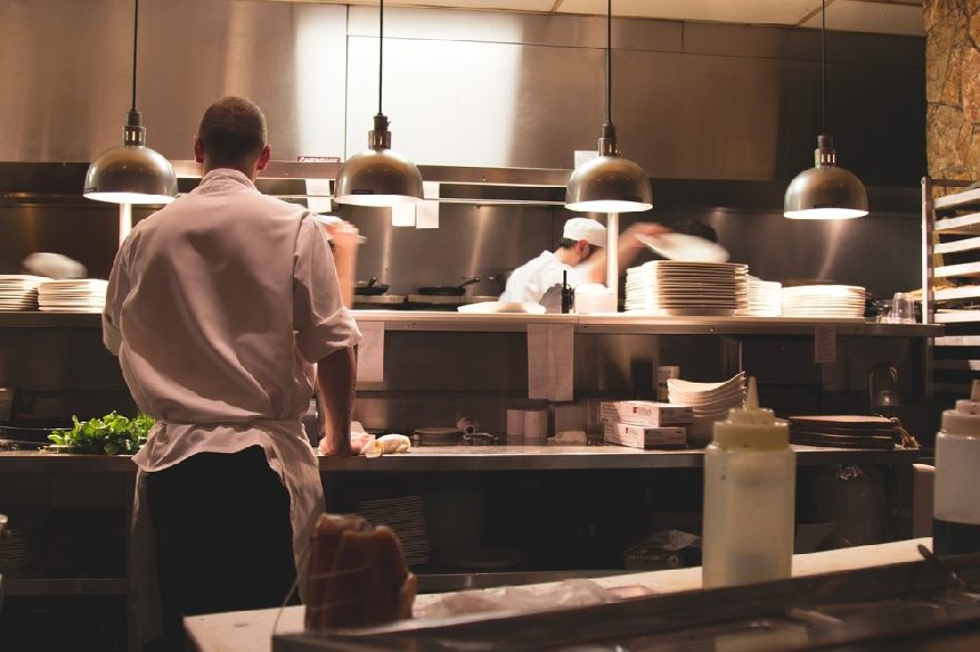 Chef preparing food in the kitchen.